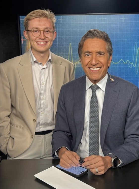 Michal Ruprecht with Dr. Sanjay Gupta in a CNN studio